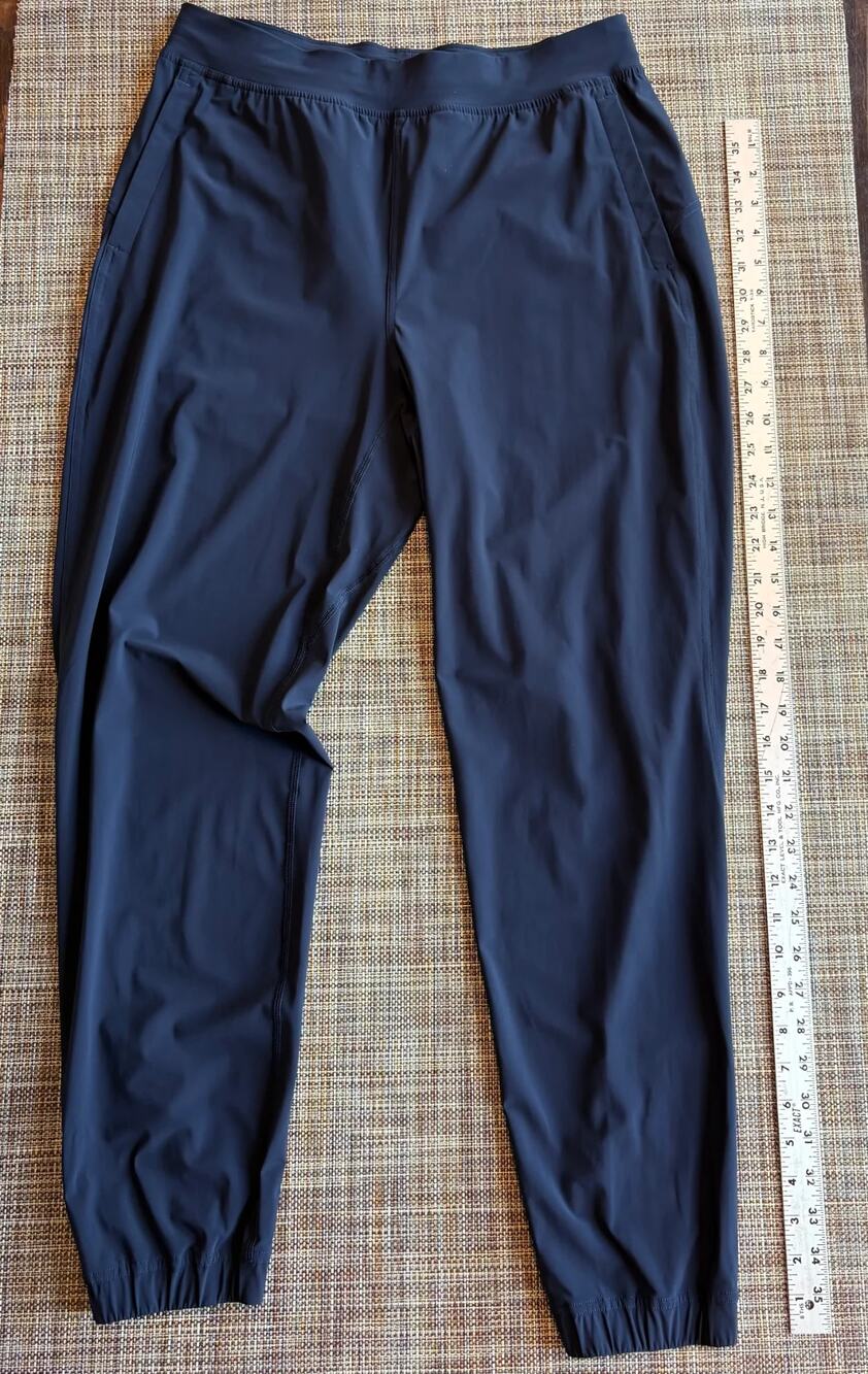 Lululemon Navy athletic Jogger style pants with zip pockets and ankle zips (Size